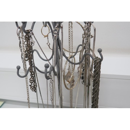 444 - Silver jewellery on stand