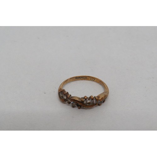 20 - 9ct Gold CZ Ring size J
Weight 1.4g.