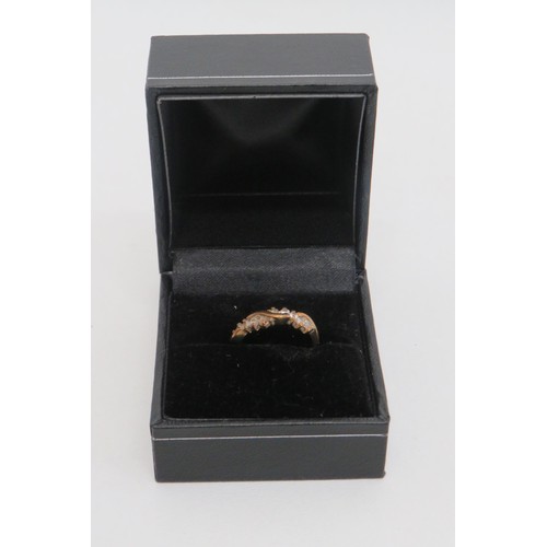 20 - 9ct Gold CZ Ring size J
Weight 1.4g.