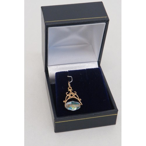 35 - 9ct Gold Aurora crystal spinner Fob Pendant.
Weight 1.3g.