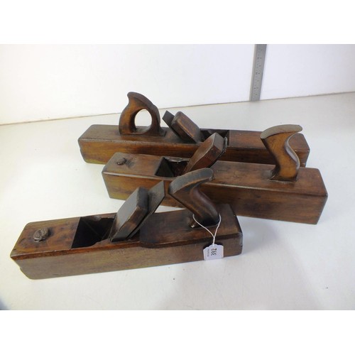 392 - Three large wooden block planes