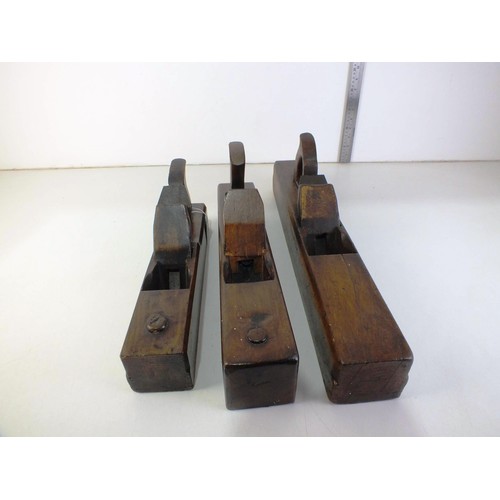 392 - Three large wooden block planes