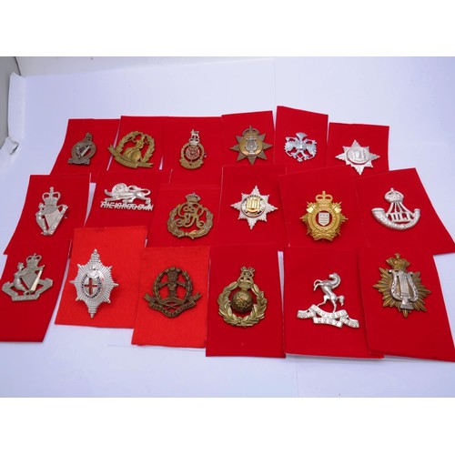 1 - 18 Military Cap badges to inc 
North Irish
Norfolk
The Kings Own 
Middlesex