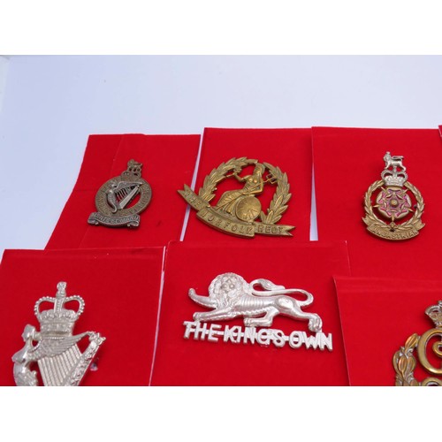 1 - 18 Military Cap badges to inc 
North Irish
Norfolk
The Kings Own 
Middlesex