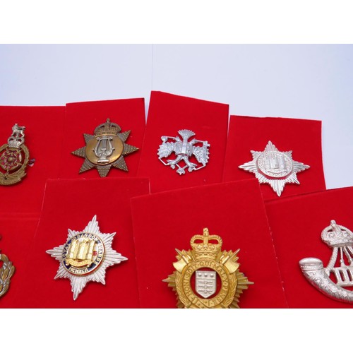 1 - 18 Military Cap badges to inc 
North Irish
Norfolk
The Kings Own 
Middlesex