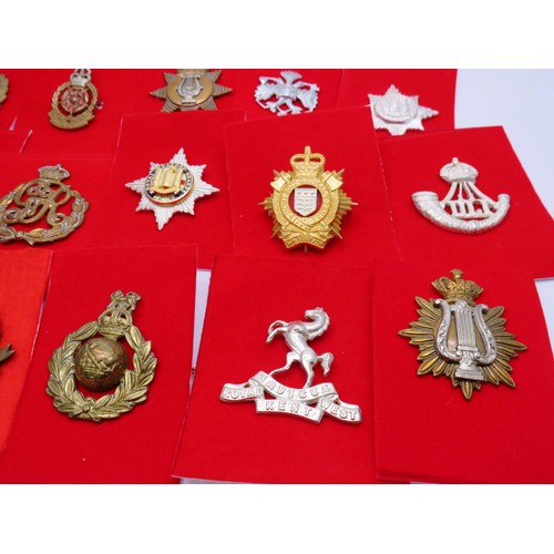 1 - 18 Military Cap badges to inc 
North Irish
Norfolk
The Kings Own 
Middlesex