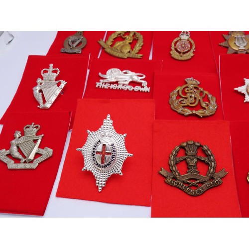 1 - 18 Military Cap badges to inc 
North Irish
Norfo;k
The Kings Own 
Middlesex