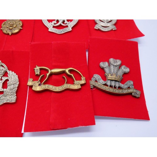 2 - 18 Military Infantry Cap badges to inc 
Berkshire 
Northumberland
Queens own Oxfordhire hussars
Quee... 