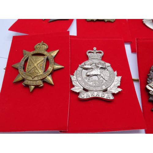 3 - 18 Canadian Military Cap badges to inc 
Hussars
De Hull
Calgary Highlanders
West Nova Scotia