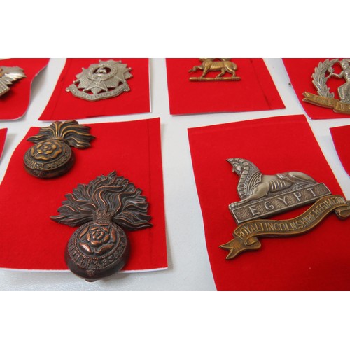 24 - 18 Military Military  badges to inc 
Norfolk
Royal Scots 
Limcolnshire