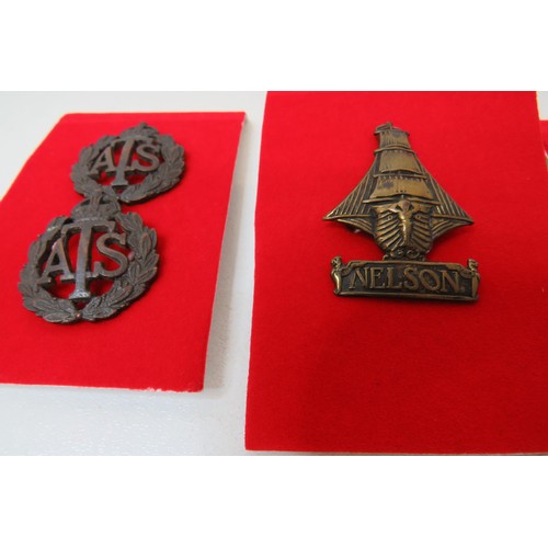 26 - 18 Military  badges to inc 
Nelson
Devonshire
Howe