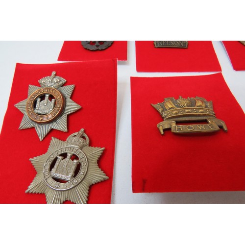 26 - 18 Military  badges to inc 
Nelson
Devonshire
Howe