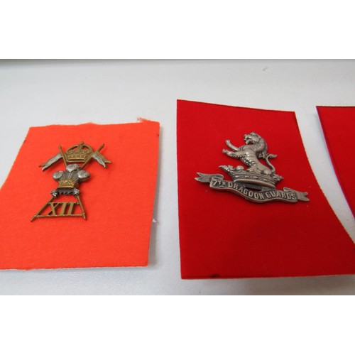 30 - 18 Military African   badges to inc 
Arabiiniers
Royal Dragoons 
X11