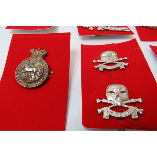 73 - 18 Military Cap/Regimental badges