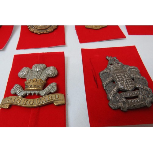 74 - 18 Military Cap/Regimental badges