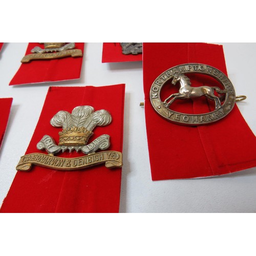 74 - 18 Military Cap/Regimental badges