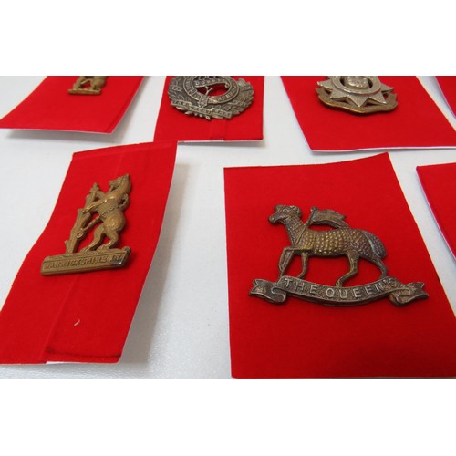 76 - 18 Military Cap/Regimental badges