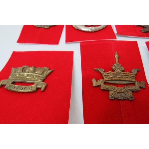 77 - 18 Military Cap/Regimental badges