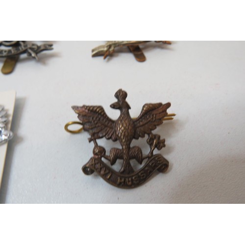 79 - 18 Military Cap/Regimental badges