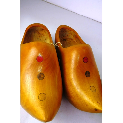 135 - Two pairs of wooden clogs