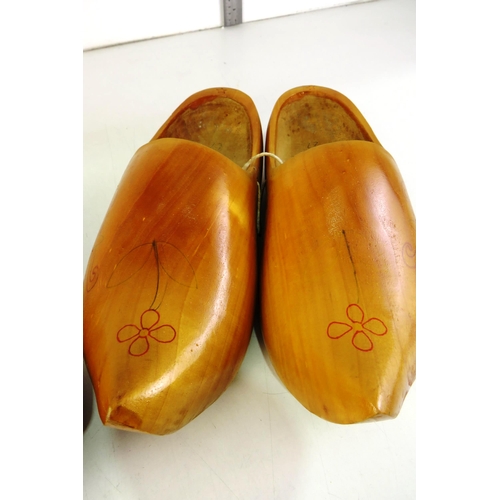 135 - Two pairs of wooden clogs