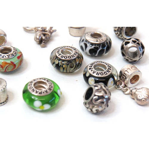 230 - Sixteen 925 Silver charm beads including genuine Pandora.