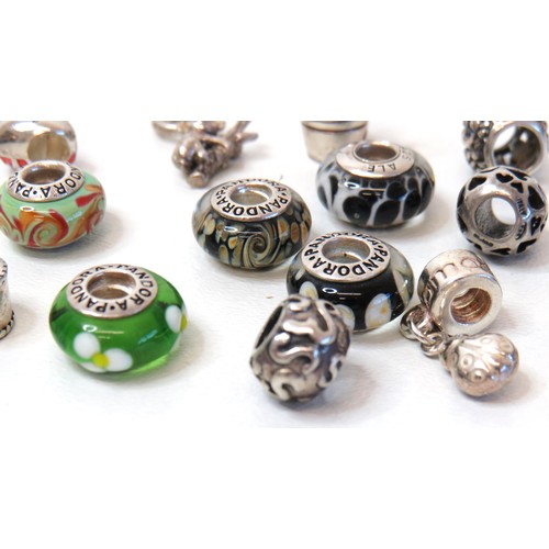 230 - Sixteen 925 Silver charm beads including genuine Pandora.