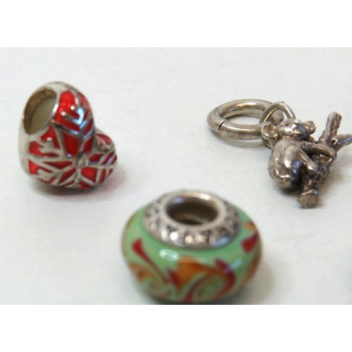 230 - Sixteen 925 Silver charm beads including genuine Pandora.