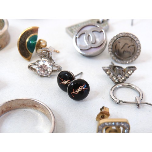 221 - Selection of Silver tone fashion Jewellery to include rings, Earrings and pendants.