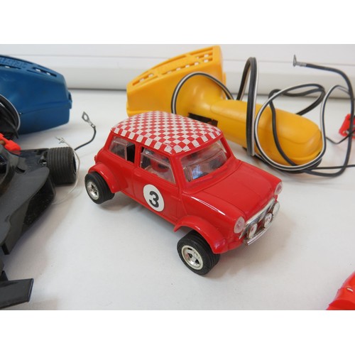 239 - Vintage Scalextric controllers and cars.