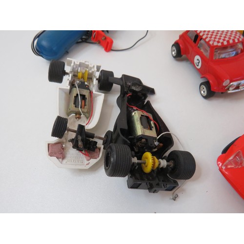 239 - Vintage Scalextric controllers and cars.