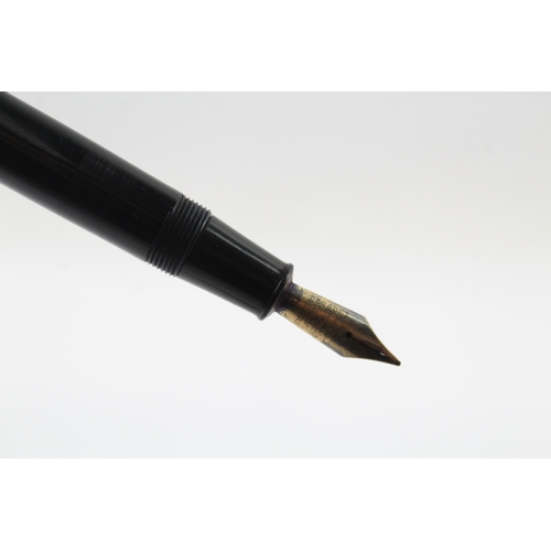 465 - Conway Stewart 77 black fountain pen with 14ct gold nib, writing