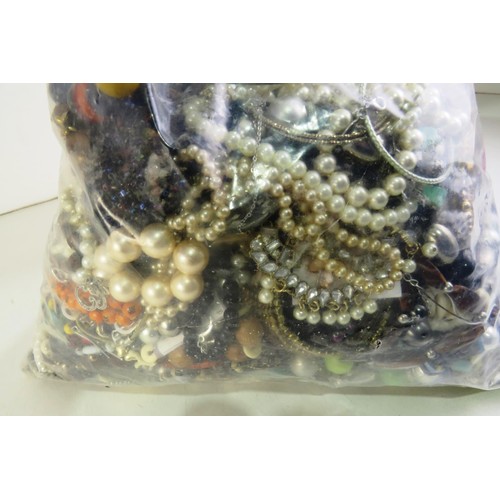 351 - 10kg bag of costume jewellery.