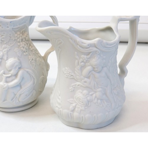 69 - A pair of Alabaster elephants, Portmerion Parian pair of jugs and boot.