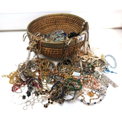 277 - Large rattan bowl full of jewellery including vintage, brooches, rings etc.