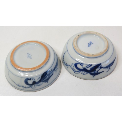 74 - A pair of Japanese hand painted Earthenware Saki cups.