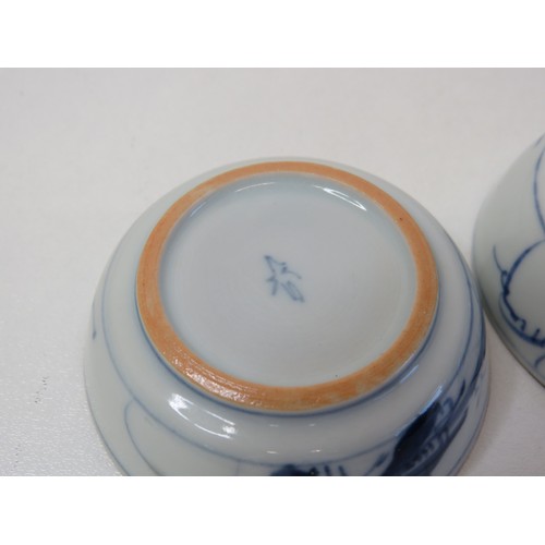 74 - A pair of Japanese hand painted Earthenware Saki cups.