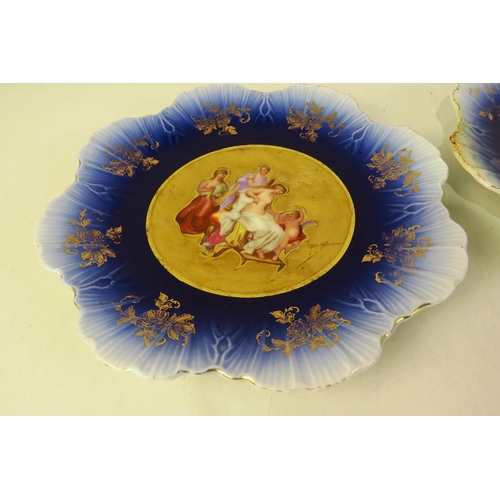 135 - Pair of cherub cabinet plates