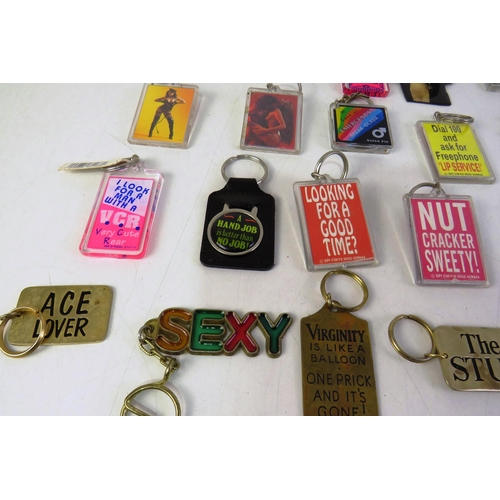 143 - Twenty-five novelty keyrings.