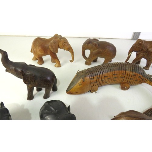 287 - Selection of wooden elephant ornaments and articulated wooden animal.