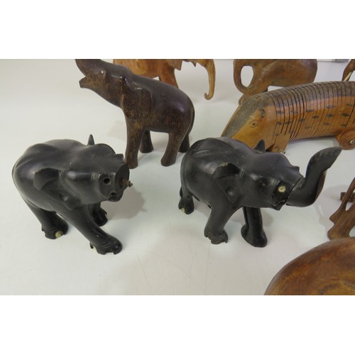 287 - Selection of wooden elephant ornaments and articulated wooden animal.