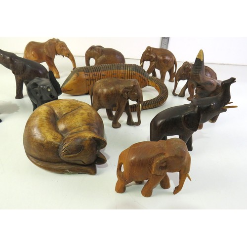 287 - Selection of wooden elephant ornaments and articulated wooden animal.