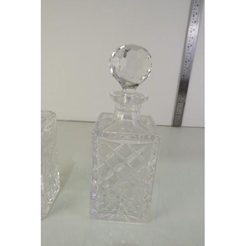 293 - Two cut glass decanters with stoppers.