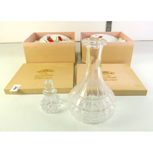 296 - Lead crystal decanter and two Leonardo collection cup & saucers, all boxed.