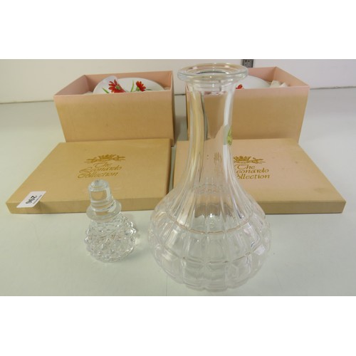 296 - Lead crystal decanter and two Leonardo collection cup & saucers, all boxed.