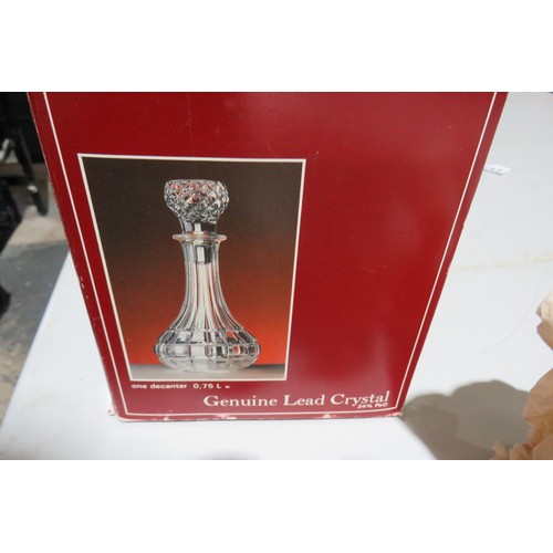 296 - Lead crystal decanter and two Leonardo collection cup & saucers, all boxed.