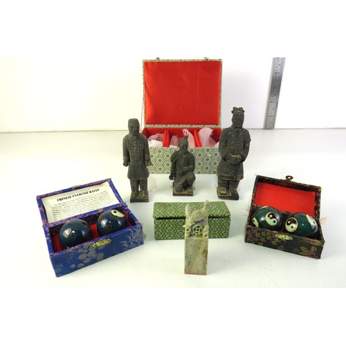 297 - Oriental chinese boading ball sets and boxed set of three terracotta warrior figures.