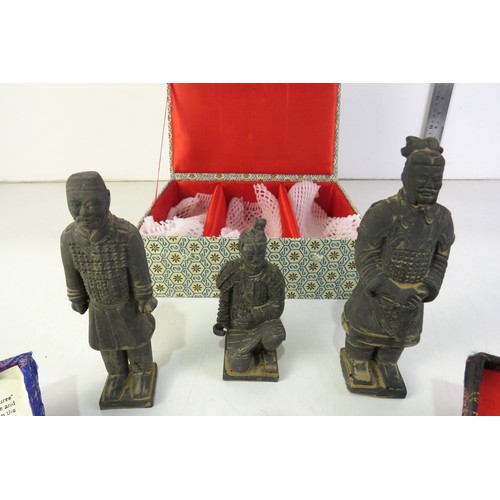 297 - Oriental chinese boading ball sets and boxed set of three terracotta warrior figures.