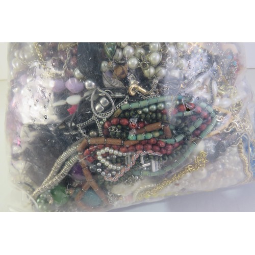 261 - 10kg bag of unsorted costume jewellery.