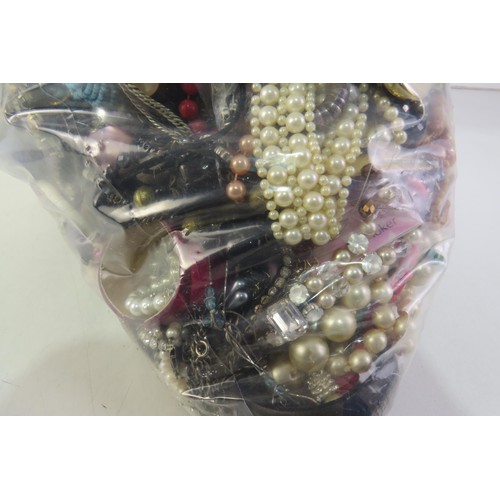 263 - 10kg bag of unsorted costume jewellery.